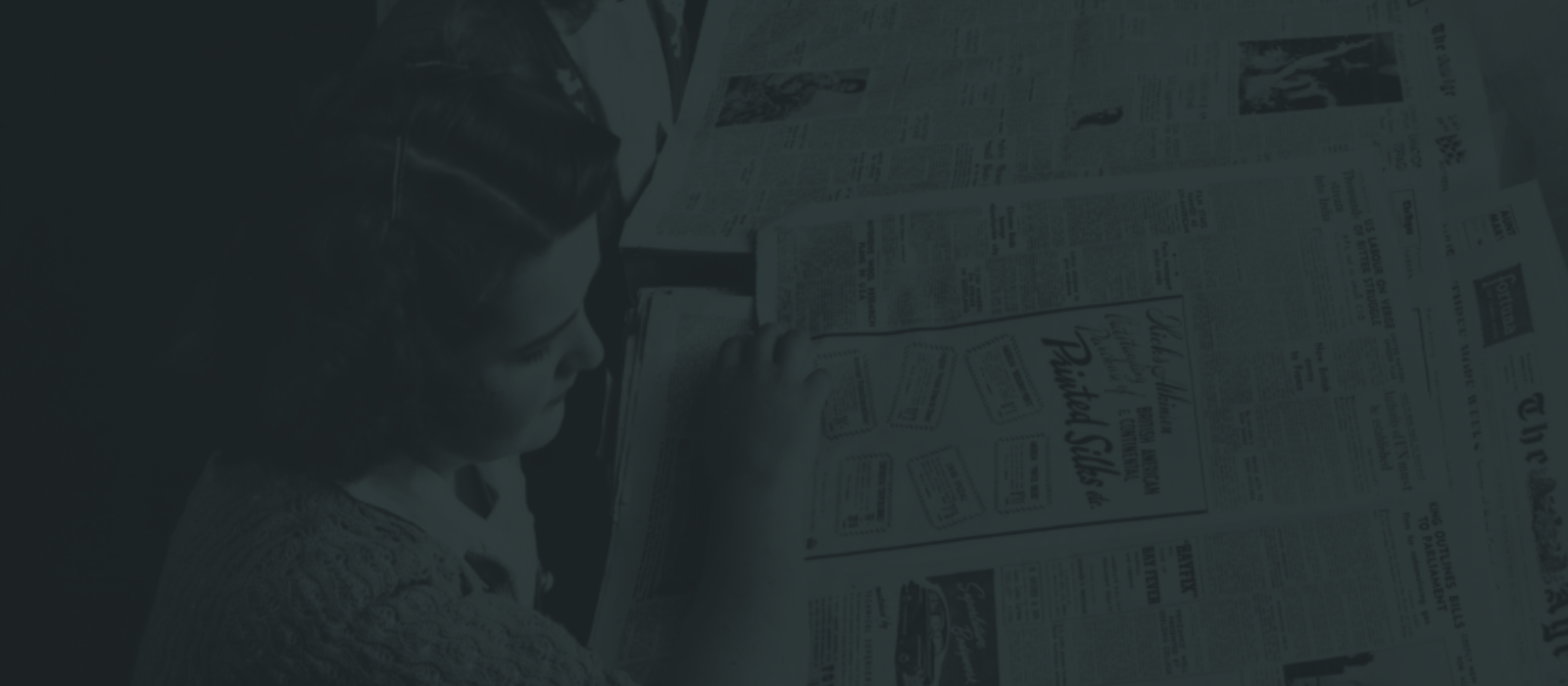 ladies reading newspapers at the library